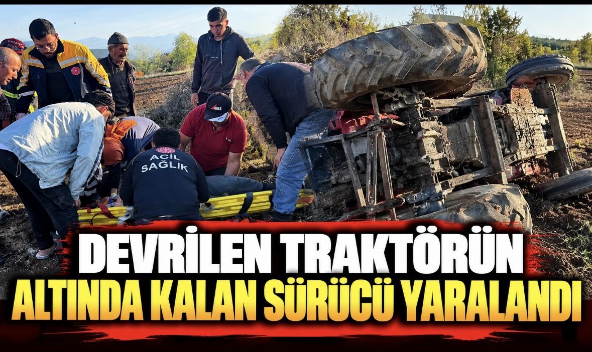 Devrilen traktörün altında kalan sürücü yaralandı
