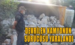 DEVRİLEN KAMYONUN SÜRÜCÜSÜ YARALANDI