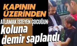 Kapının üzerinden atlamak isteyen çocuğun koluna demir saplandı