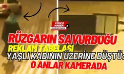 Rüzgarın savurduğu reklam tabelası yaşlı kadının üzerine düştü: O anlar kamerada