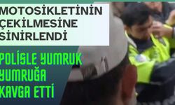 Motosikletinin çekilmesine sinirlendi, polisle yumruk yumruğa kavga etti