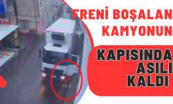 Freni boşalan kamyonun kapısında asılı kaldı...