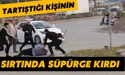 Tartıştığı kişinin sırtında süpürge kırdı