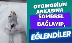 Otomobilin arkasına şambrel bağlayıp, eğlendiler