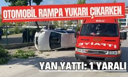 Otomobil rampa yukarı çıkarken yan yattı: 1 yaralı