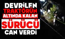 Devrilen traktörün altında kalan sürücü can verdi