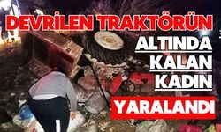 Devrilen traktörün altında kalan kadın yaralandı
