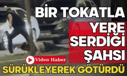 Bir tokatla yere serdiği şahsı sürükleyerek götürdü