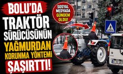 Bolu'da traktör sürücüsünün yağmurdan korunma yöntemi şaşırttı