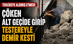 Tehlikeye aldırış etmedi: Çöken alt geçide girip testereyle demir kesti