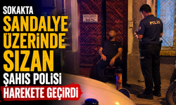 Sokakta sandalye üzerinde sızan şahıs polisi harekete geçirdi