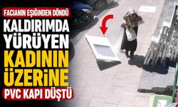 Kaldırımda yürüyen kadının üzerine PVC kapı düştü