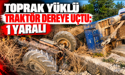 Toprak yüklü traktör dereye uçtu: 1 yaralı