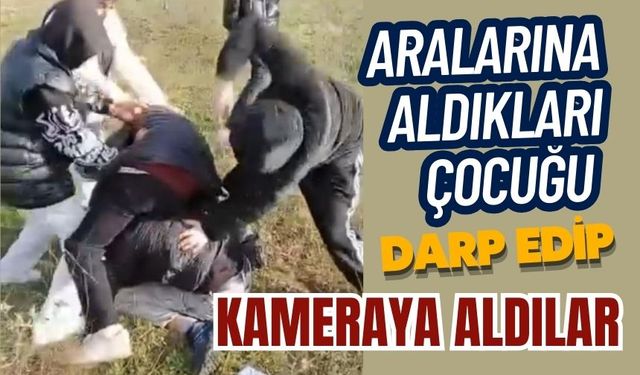 Aralarına aldıkları çocuğu darp edip kameraya aldılar