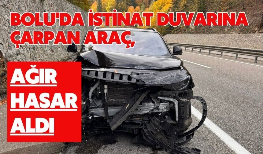 Bolu'da istinat duvarına çarpan araç, ağır hasar aldı