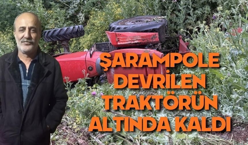 Devrilen traktörün altında kaldı